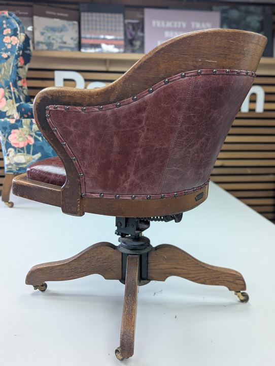 The chair from behind, showing the leather outside back