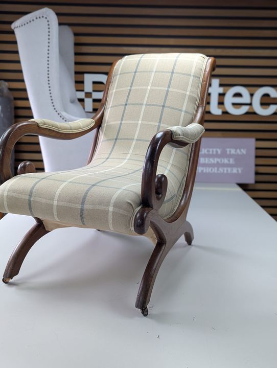 The scroll-arm chair after, in a pale herringbone check