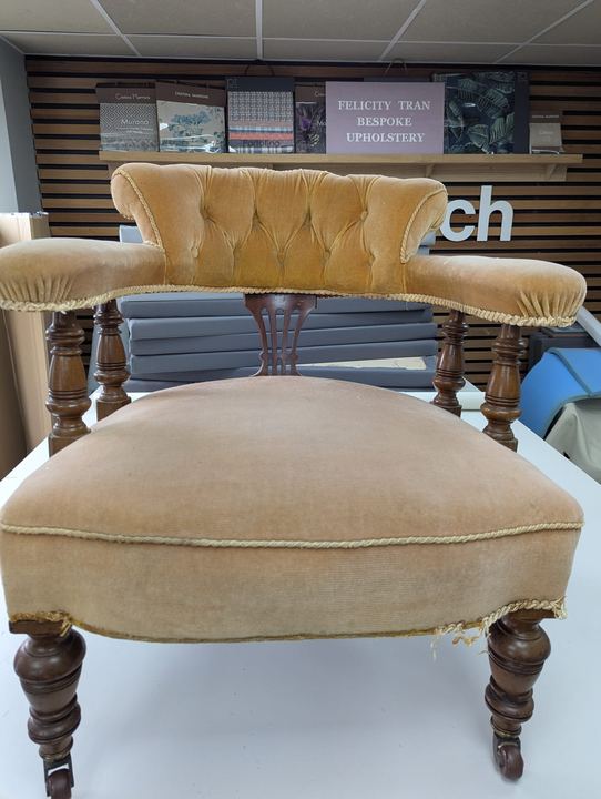 Victorian tub chair before, in worn and faded gold velvet