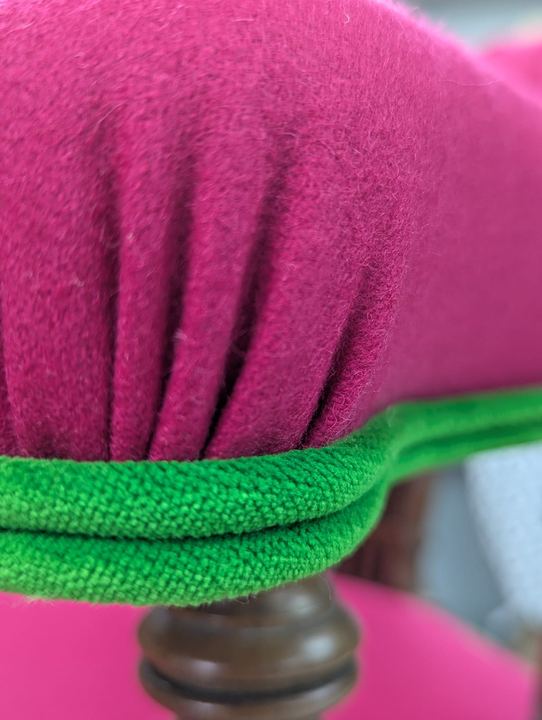 Pleated arm end with lime-green piping