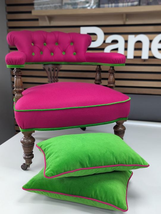 The finished chair with two lime-green cushions