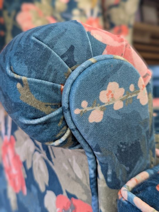 Close-up of the piped scroll arm